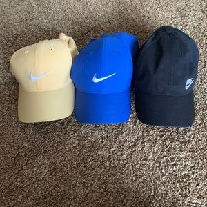 Lot of 3 Nike baseball caps / hats in blue, yellow, and black